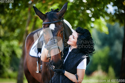 Image of beautiful girl with horse