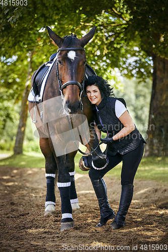 Image of beautiful girl with horse