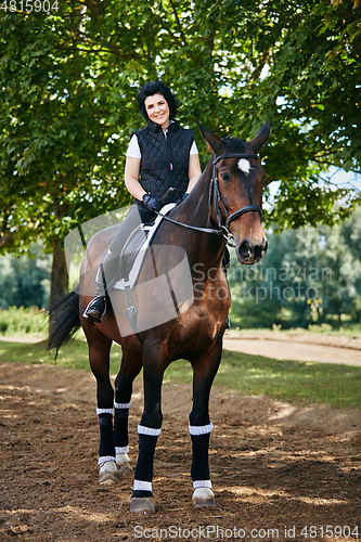 Image of beautiful girl with horse