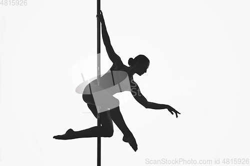 Image of beautiful pole dancer girl silhouette