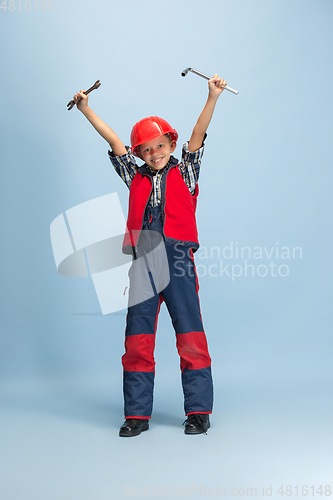 Image of Boy dreaming about future profession of engineer