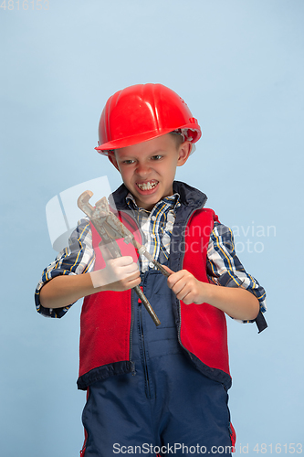 Image of Boy dreaming about future profession of engineer