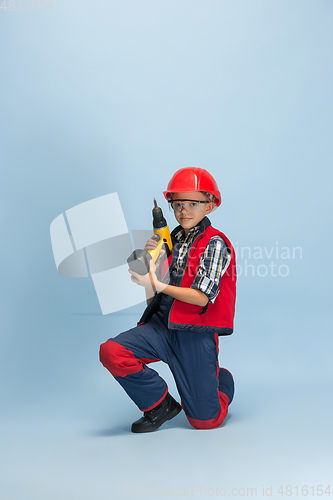 Image of Boy dreaming about future profession of engineer