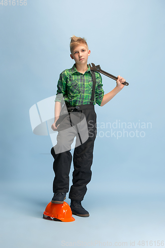 Image of Boy dreaming about future profession of engineer