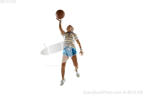 Image of Senior woman playing basketball in sportwear on white background