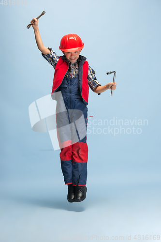 Image of Boy dreaming about future profession of engineer