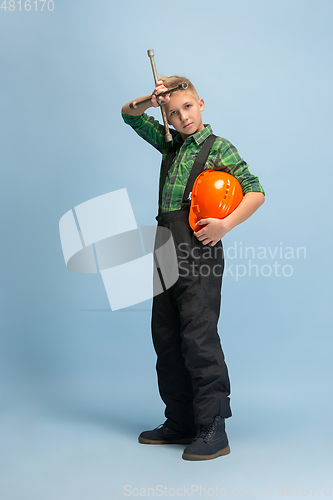 Image of Boy dreaming about future profession of engineer