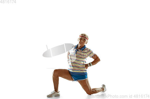 Image of Senior woman training like athlete in sportwear on white background