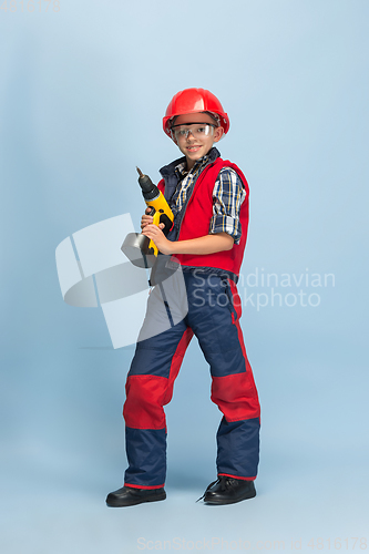 Image of Boy dreaming about future profession of engineer