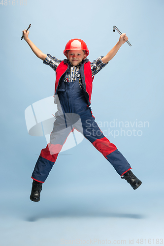 Image of Boy dreaming about future profession of engineer