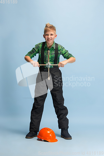 Image of Boy dreaming about future profession of engineer