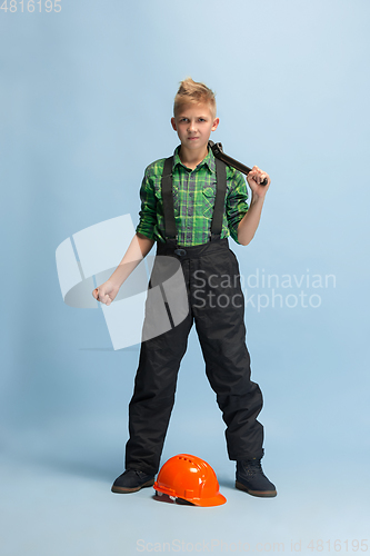 Image of Boy dreaming about future profession of engineer