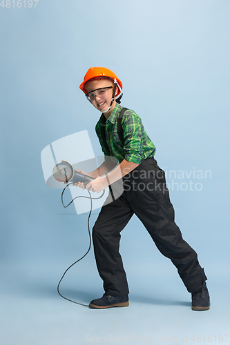 Image of Boy dreaming about future profession of engineer