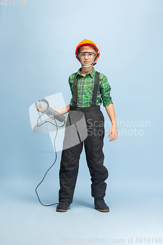 Image of Boy dreaming about future profession of engineer