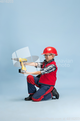 Image of Boy dreaming about future profession of engineer