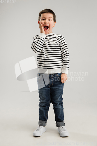 Image of Caucasian boy isolated on white studio background. Copyspace. Childhood, education, emotions concept