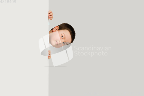 Image of Caucasian boy isolated on white studio background. Copyspace. Childhood, education, emotions concept