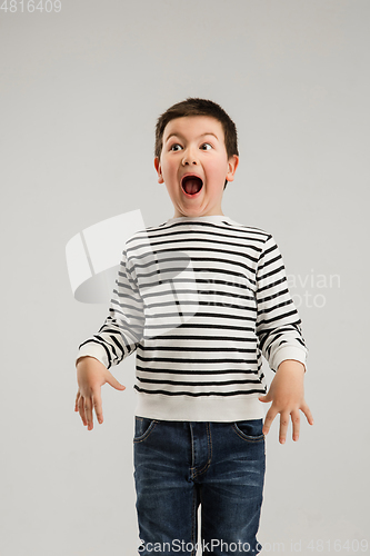 Image of Caucasian boy isolated on white studio background. Copyspace. Childhood, education, emotions concept