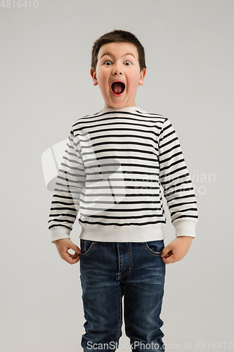 Image of Caucasian boy isolated on white studio background. Copyspace. Childhood, education, emotions concept
