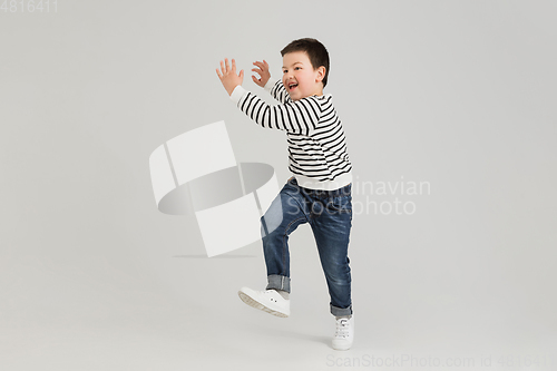 Image of Caucasian boy isolated on white studio background. Copyspace. Childhood, education, emotions concept
