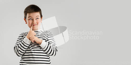 Image of Caucasian boy isolated on white studio background. Copyspace. Childhood, education, emotions concept