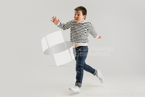 Image of Caucasian boy isolated on white studio background. Copyspace. Childhood, education, emotions concept