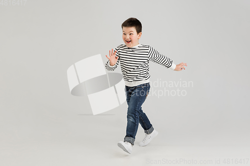 Image of Caucasian boy isolated on white studio background. Copyspace. Childhood, education, emotions concept