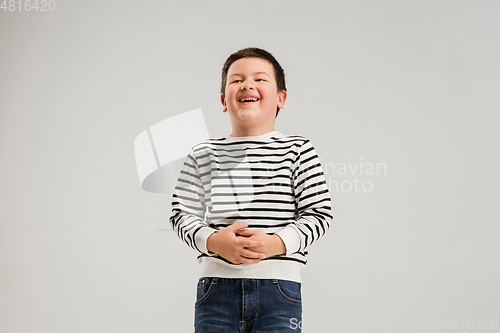 Image of Caucasian boy isolated on white studio background. Copyspace. Childhood, education, emotions concept