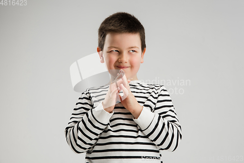 Image of Caucasian boy isolated on white studio background. Copyspace. Childhood, education, emotions concept