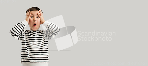 Image of Caucasian boy isolated on white studio background. Copyspace. Childhood, education, emotions concept