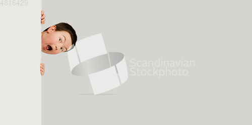 Image of Caucasian boy isolated on white studio background. Copyspace. Childhood, education, emotions concept