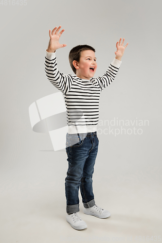 Image of Caucasian boy isolated on white studio background. Copyspace. Childhood, education, emotions concept