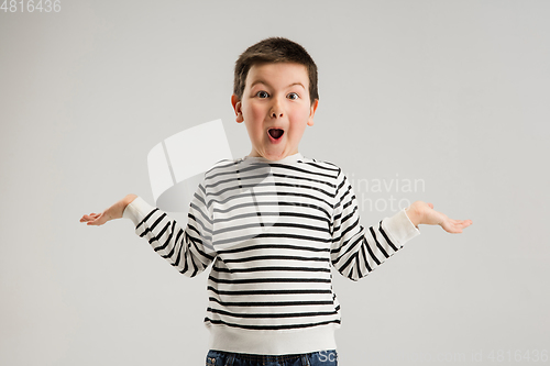 Image of Caucasian boy isolated on white studio background. Copyspace. Childhood, education, emotions concept