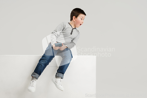 Image of Caucasian boy isolated on white studio background. Copyspace. Childhood, education, emotions concept