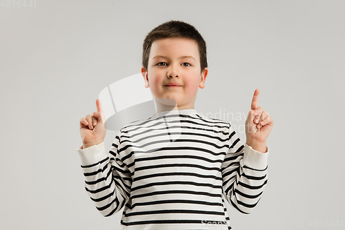 Image of Caucasian boy isolated on white studio background. Copyspace. Childhood, education, emotions concept