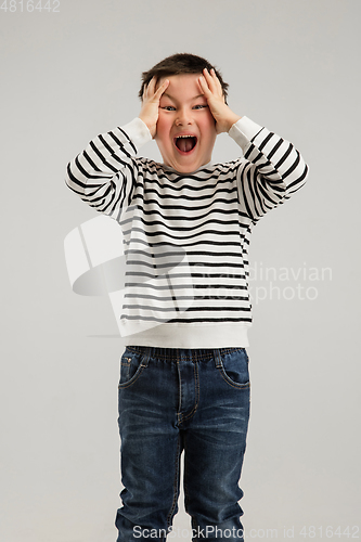 Image of Caucasian boy isolated on white studio background. Copyspace. Childhood, education, emotions concept