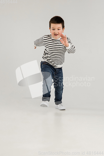 Image of Caucasian boy isolated on white studio background. Copyspace. Childhood, education, emotions concept