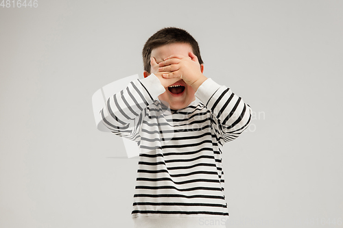 Image of Caucasian boy isolated on white studio background. Copyspace. Childhood, education, emotions concept