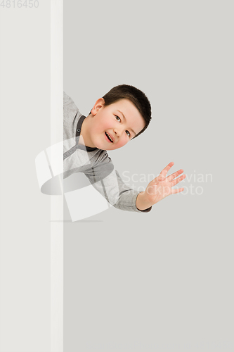 Image of Caucasian boy isolated on white studio background. Copyspace. Childhood, education, emotions concept