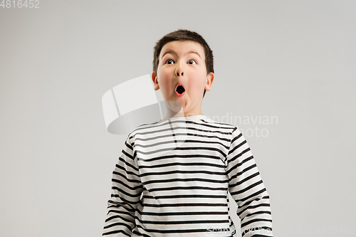 Image of Caucasian boy isolated on white studio background. Copyspace. Childhood, education, emotions concept