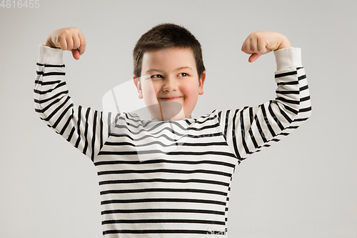 Image of Caucasian boy isolated on white studio background. Copyspace. Childhood, education, emotions concept