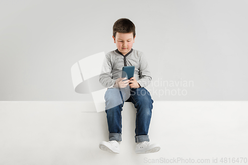 Image of Caucasian boy isolated on white studio background. Copyspace. Childhood, education, emotions concept
