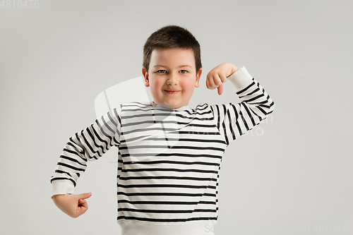Image of Caucasian boy isolated on white studio background. Copyspace. Childhood, education, emotions concept