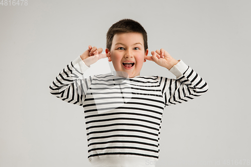 Image of Caucasian boy isolated on white studio background. Copyspace. Childhood, education, emotions concept