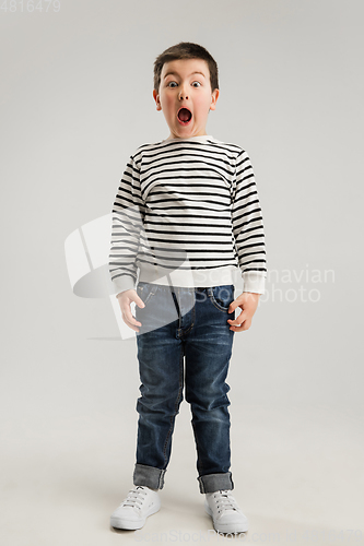 Image of Caucasian boy isolated on white studio background. Copyspace. Childhood, education, emotions concept
