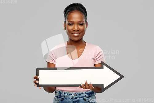 Image of african american woman with rightwards arrow