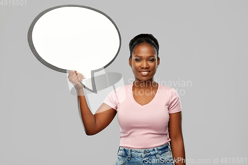 Image of happy african american woman holding speech bubble