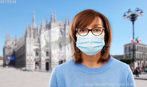 Image of senior woman in protective medical mask in italy