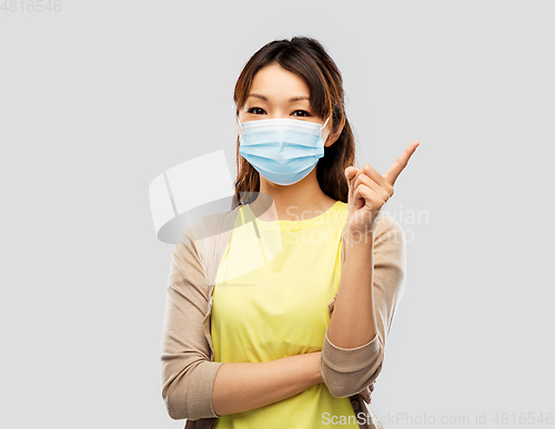 Image of asian young woman in protective medical mask