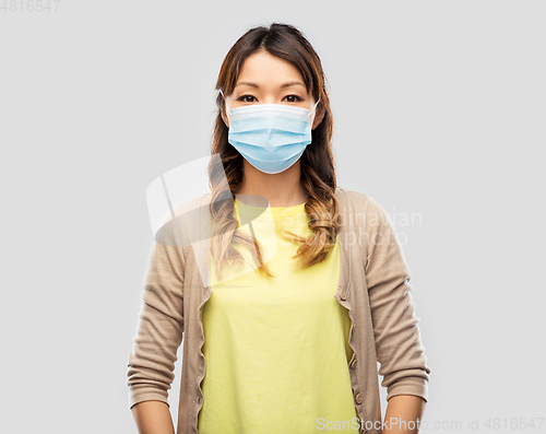 Image of asian young woman in protective medical mask